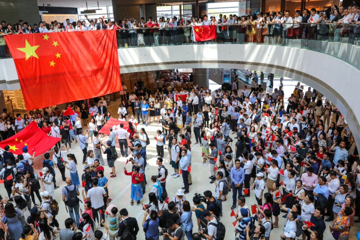 Pro-China demonstrators, with China flags, sing the national anthem and gather at the International Finance Centre (IFC) in Central as part of a flashmob during the Hong Kong protests in September.