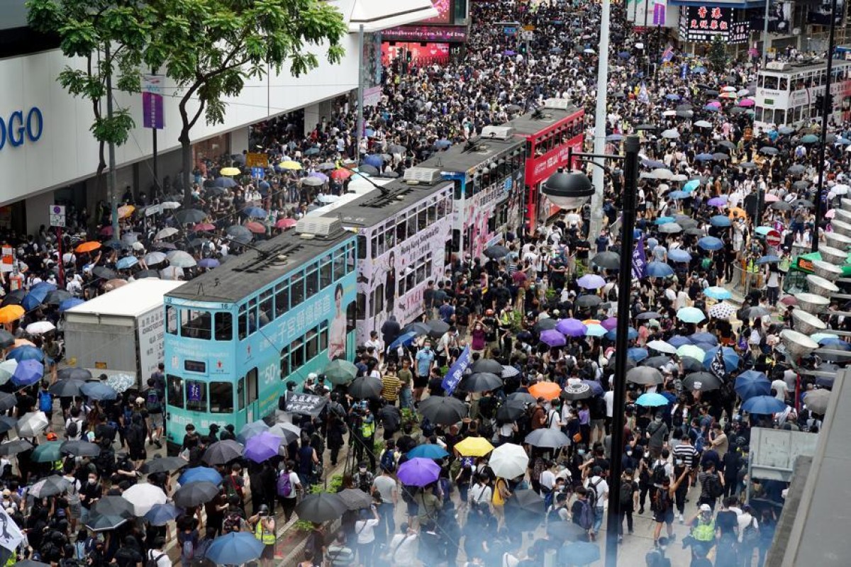 Protesters gather near Sogo department store in Causeway Bay for a march between Causeway Bay and Wan Chai to protest against the government's proposed enactment of national security law.