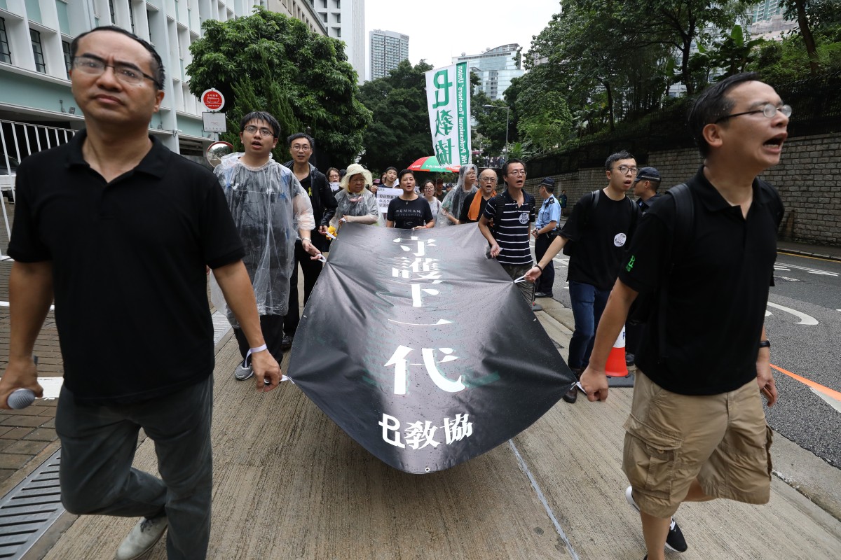 Hong Kong Professional Teachers' Union President Fung Wai-wah and Vice-President Ip Kin-yuen lead the teachers' rally for the withdrawl of the extradition bill in August 2019; Fung has asked the government to avoid interference into education.