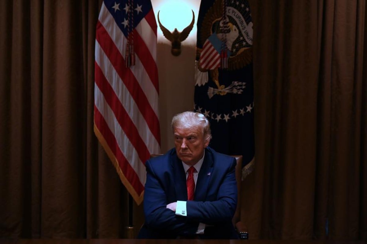 US President Donald Trump sits at a roundtable discussion he's very excited to be at. Photo: AFP