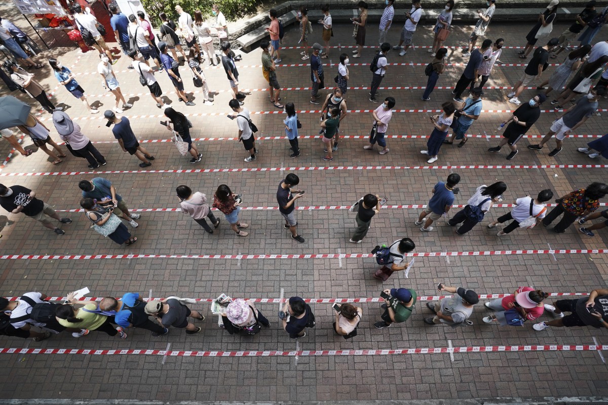 People queue up to vote at a polling station outside Tai Po Plaza in Tai Po for day two of democratic parties' primary election to select candidates for the upcoming Legislative Council elections. Photo: SCMP / Felix Wong
