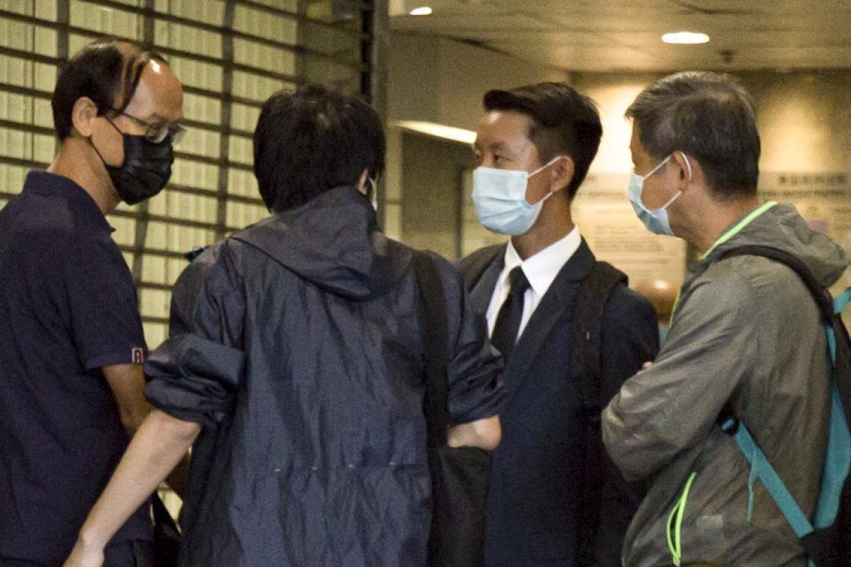 Wong Chi-yan (centre) outside Eastern Court on Wednesday. Photo: SCMP/ Brian Wong
