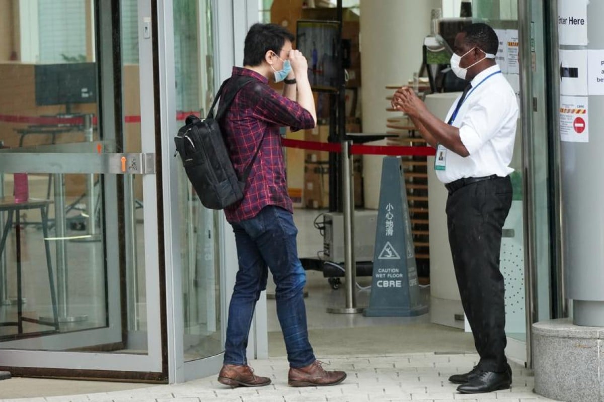 A security guard greets a student at the University of Hong Kong’s faculty of medicine in Pok Fu Lam earlier this month. Photo: SCMP/ Sam Tsang