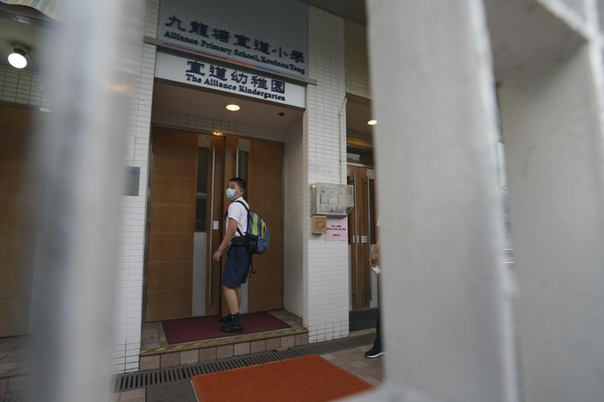A student walks into the Alliance Primary School in Kowloon Tong. Photo: SCMP/ Felix Wong