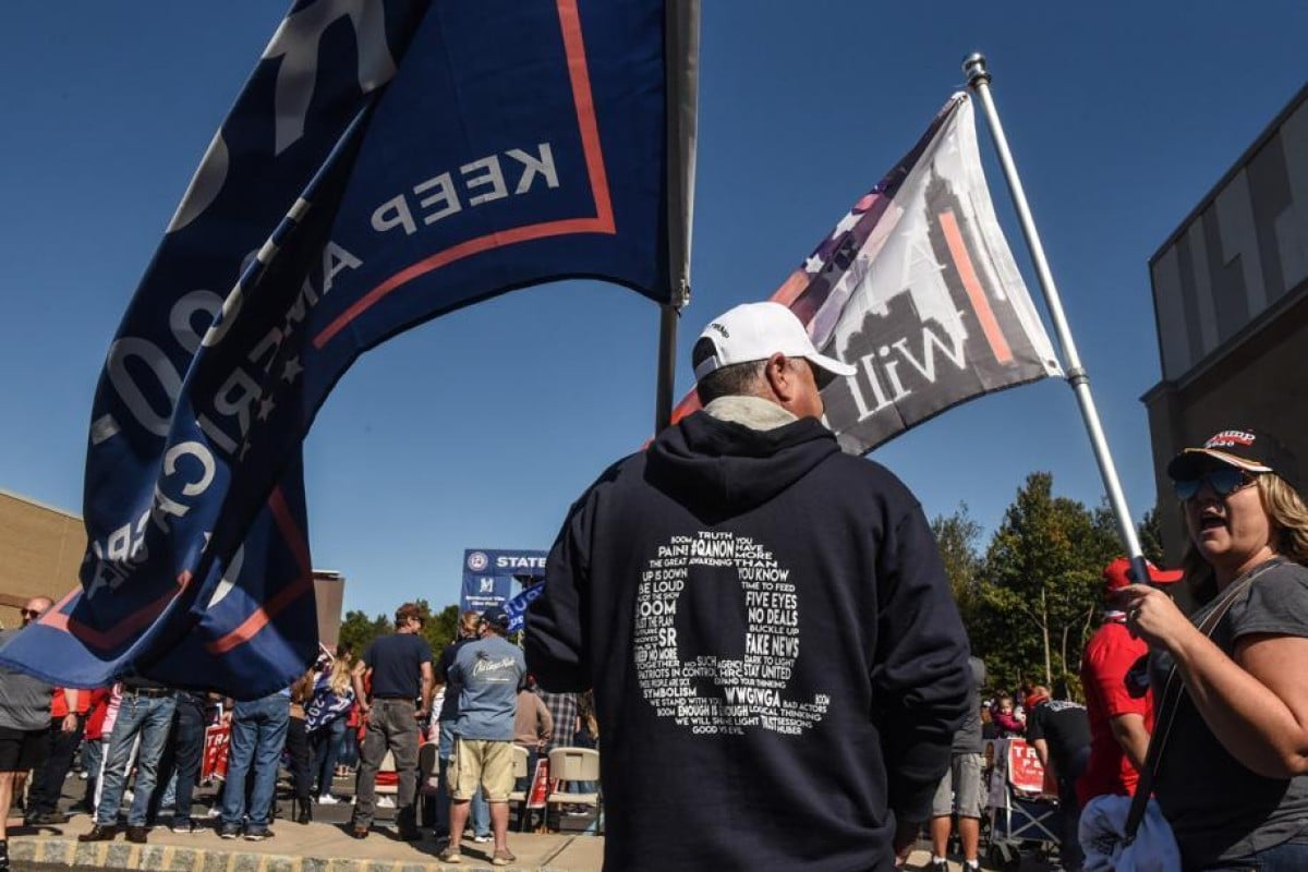 A person wears a QAnon sweatshirt during a pro-Trump rally in New York. Photo: AFP