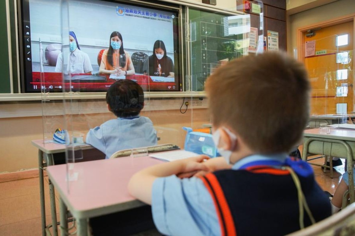 Dividers separate students at Yau Ma Tei Catholic Primary School during their first day of face-to-face classes in months. Photo: SCMP/ Winson Wong