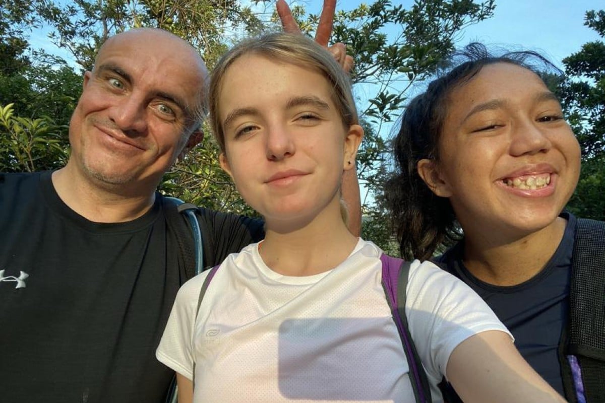 Chloe (middle), her dad and her friend Megan decided to raise money for Operation Santa Claus by walking the entire Hong Kong trail in one day. Photo: Chloe Jones