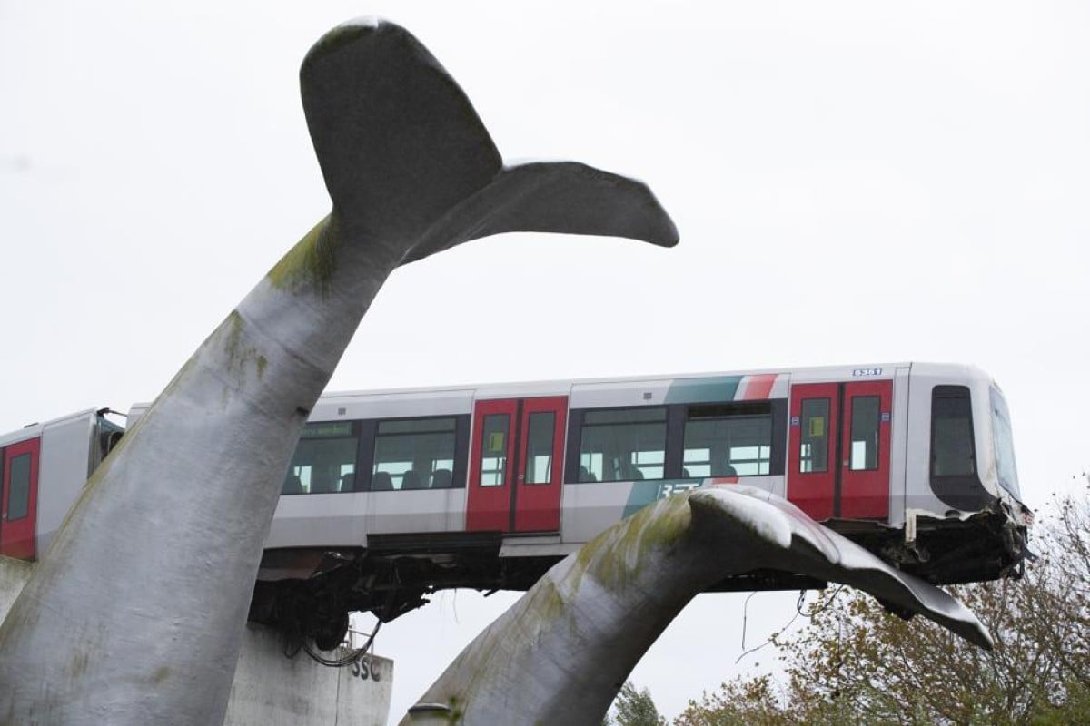 A whale tail sculpture holds the front carriage of a metro train as it rammed through the end of an elevated section of tracks in Spijkenisse, near Rotterdam, Netherlands. Photo: AP