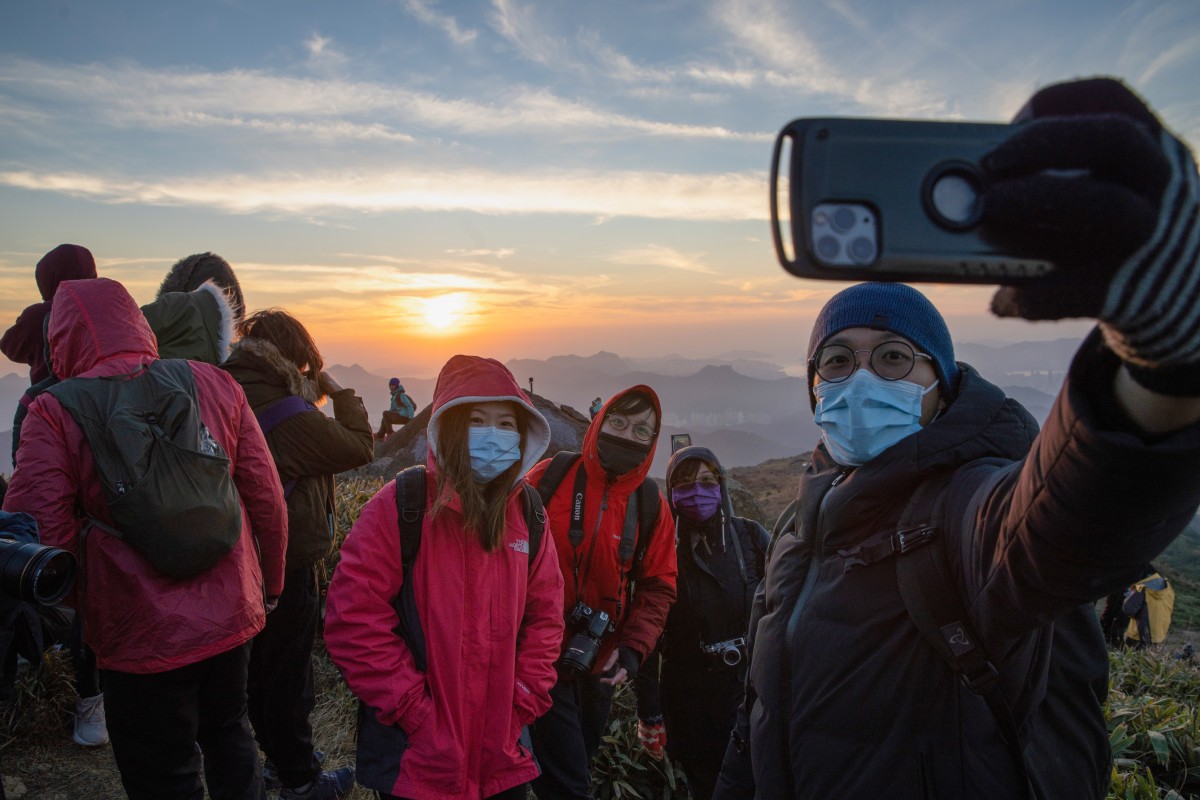 A sun rise is seen from the Tai Mo Shan on New Year's Day. Photo: SCMP/Winson Wong