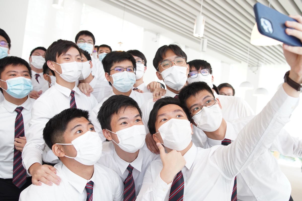 Diocesan Boys' School students who earned 45 and 44 points on the International Baccalaureate (IB) pose for a photo on campus. Photo: SCMP/Winson Wong