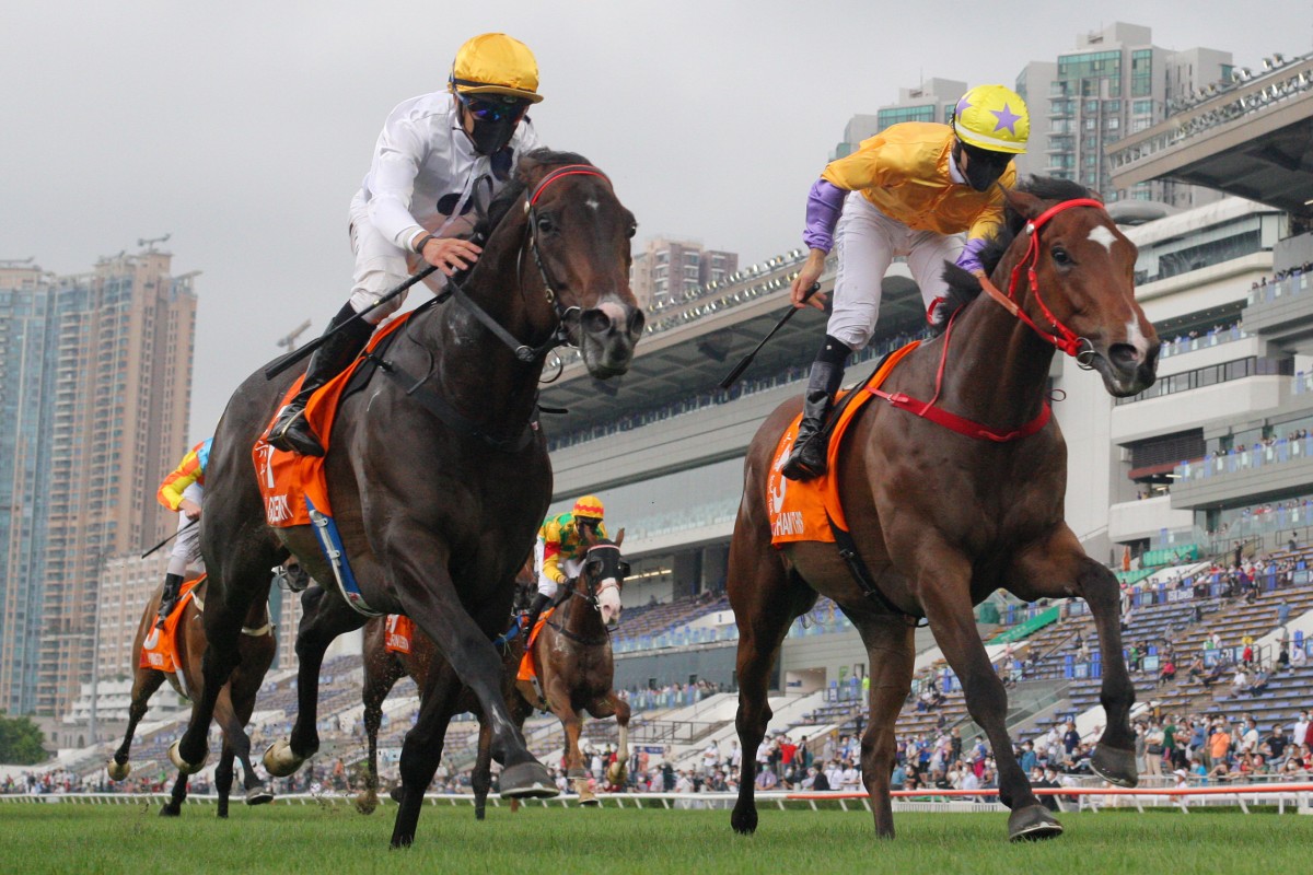 Vincent Ho guides Golden Sixty (left) to victory in the Group One Champions Mile at Sha Tin on Sunday. Photos: Kenneth Chan