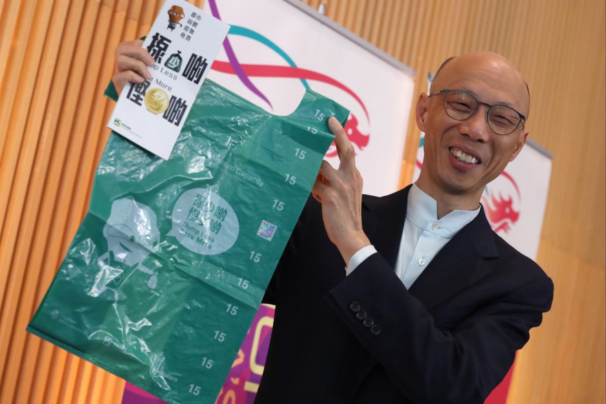 Secretary for the Environment Wong Kam-sing holds up an example of one of the rubbish bags that could be used under the waste-charging scheme. Photo: SCMP/ Nora Tam