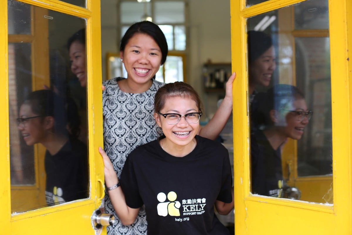 Sky Siu (back) has been with the KELY Support Group for 10 years. The NGO has helped a lot of teenagers in Hong Kong, including Xyra Sace (back). Photo: Nora Tam