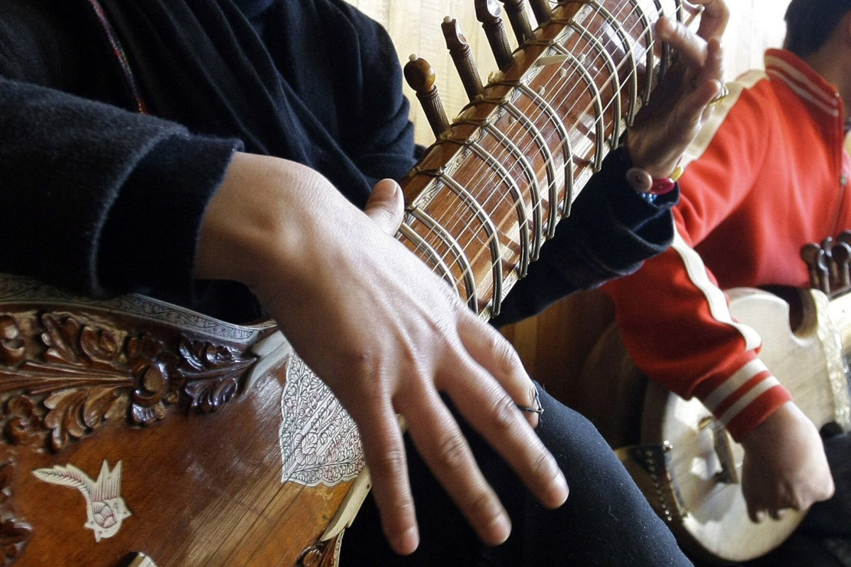 A girl practices playing the sitar in a class at the Afghan National Institute of Music in Kabul, Afghanistan. Photo: AP