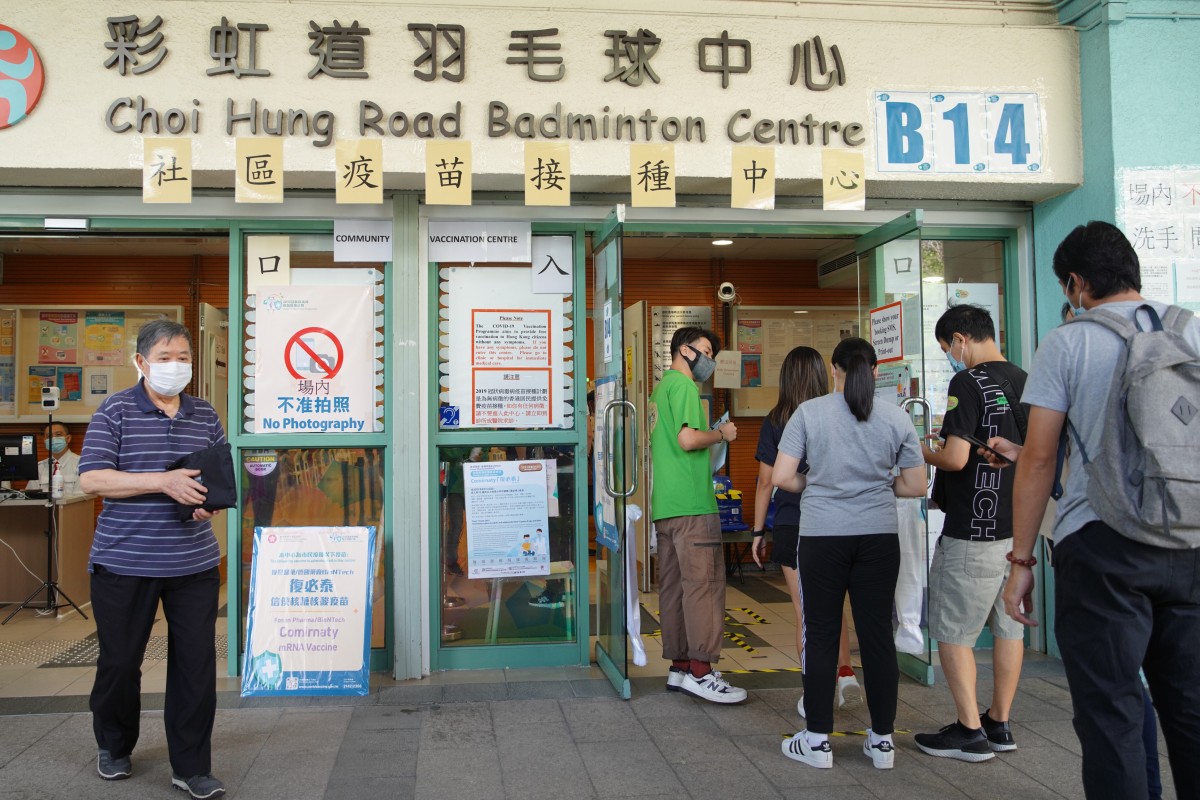People line up for the BioNTech vaccination at Choi Hung Road Badminton Centre in San Po Kong. Photo: SCMP/ Winson Wong