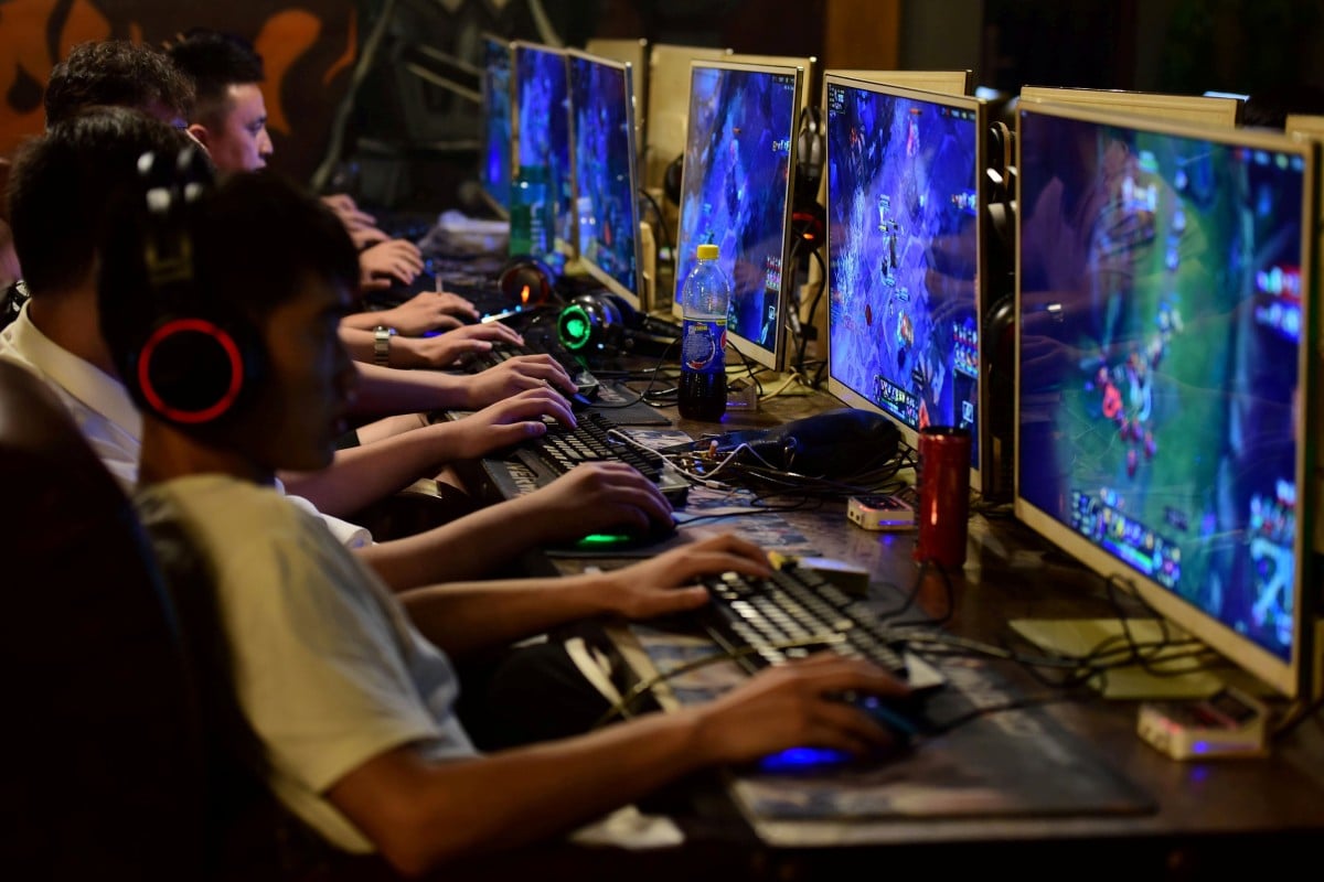 People play online games at an internet cafe in Fuyang, Anhui province, China. Starting from tomorrow, minors under the age of 18 will be limited to three hours of online gaming per week. Photo: Reuters