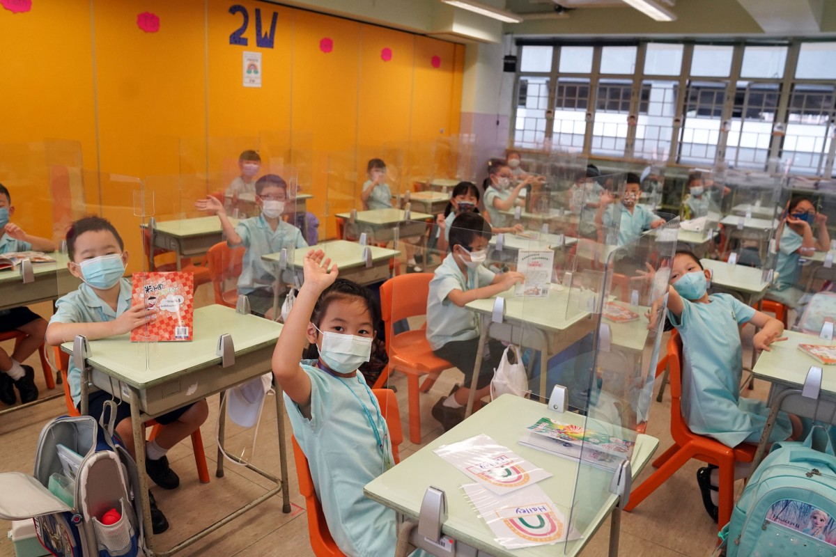 Students sit in their classroom at Fukien Secondary School Affiliated School in Yau Tong. Hong Kong pupils returned to campus for half-day lessons today, the first day of the new school year. Photo: SCMP/ Sam Tsang