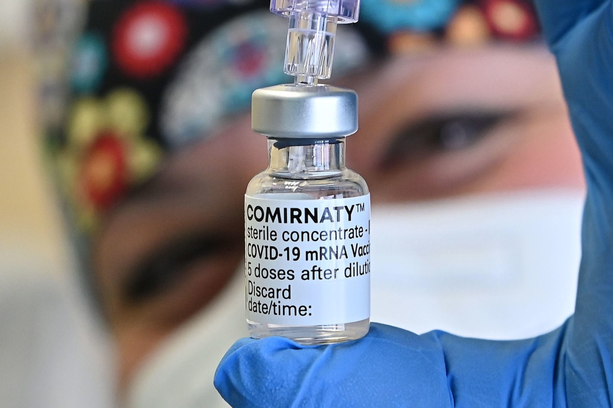A healthcare worker holds up a vial of the Pfizer-BioNTech Covid-19 vaccine at Molinette hospital in Turin, Italy. The pharmaceutical giant said the vaccine was working with children aged five to 11. Photo: EPA-EFE