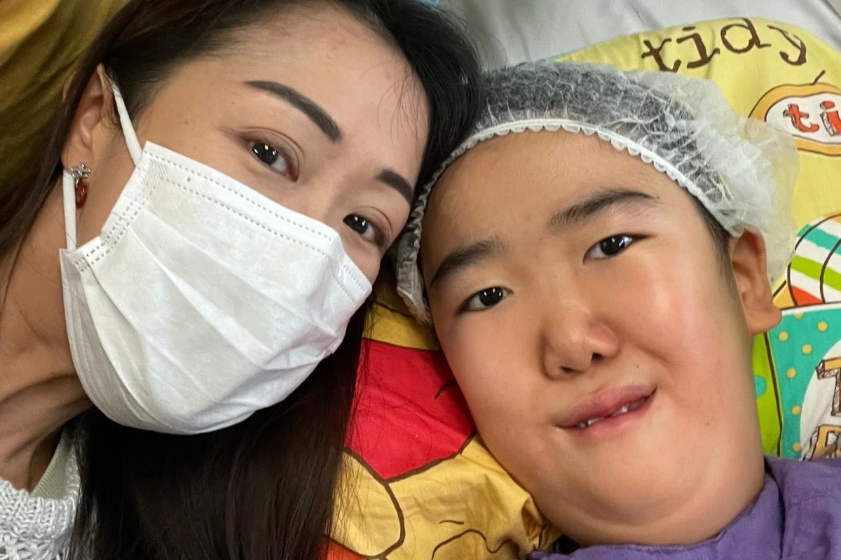 Ten-year-old Marcus Ng poses with his mother, Wenus Chan, before successfully undergoing high-risk spinal surgery on Monday. Photo: Handout
