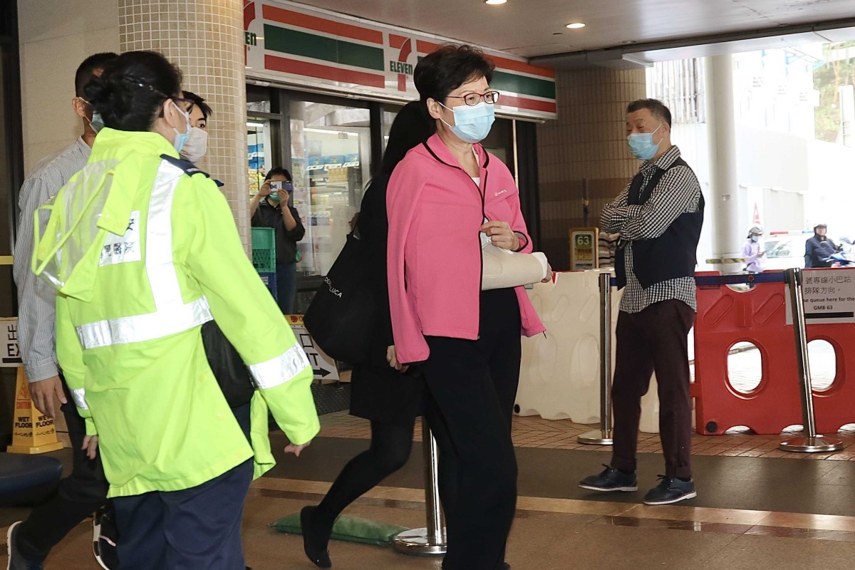 Chief Executive Carrie Lam leaves the Queen Mary Hospital wearing a sling. Photo: Handout