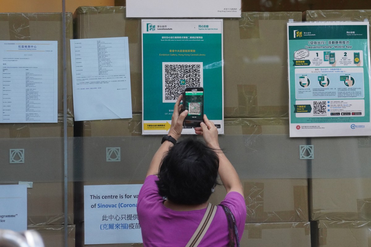 Visitors must scan QR codes specific to government premises before they can enter. Photo: Winson Wong