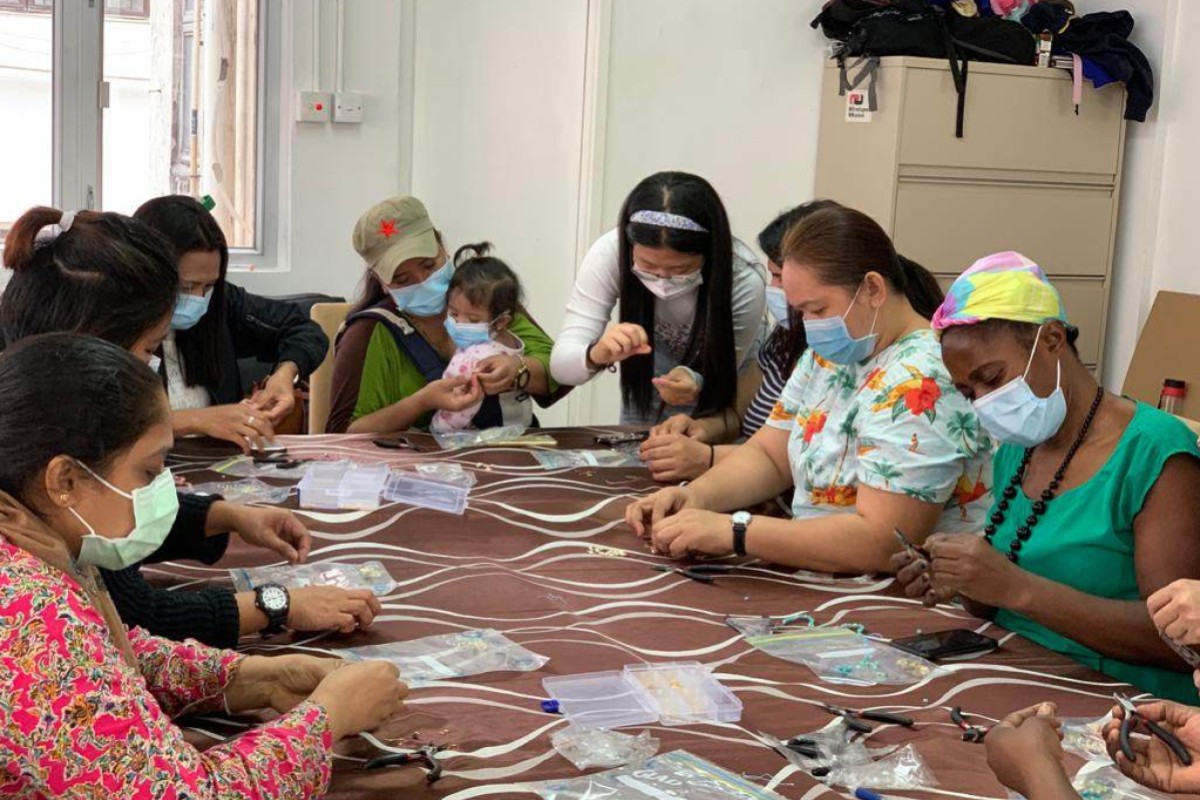 Sophia Zhang (centre) ran arts and crafts workshops for refugees, sold the items they made and donated the proceeds to the Refugee Union to distribute to its members. Photo: Maggie Du