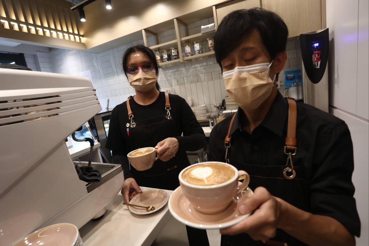 Sandy Wong (left) and Tang Tsz-long are training to work at Yau Cafe in Sai Ying Pun. Photo: Jonathan Wong