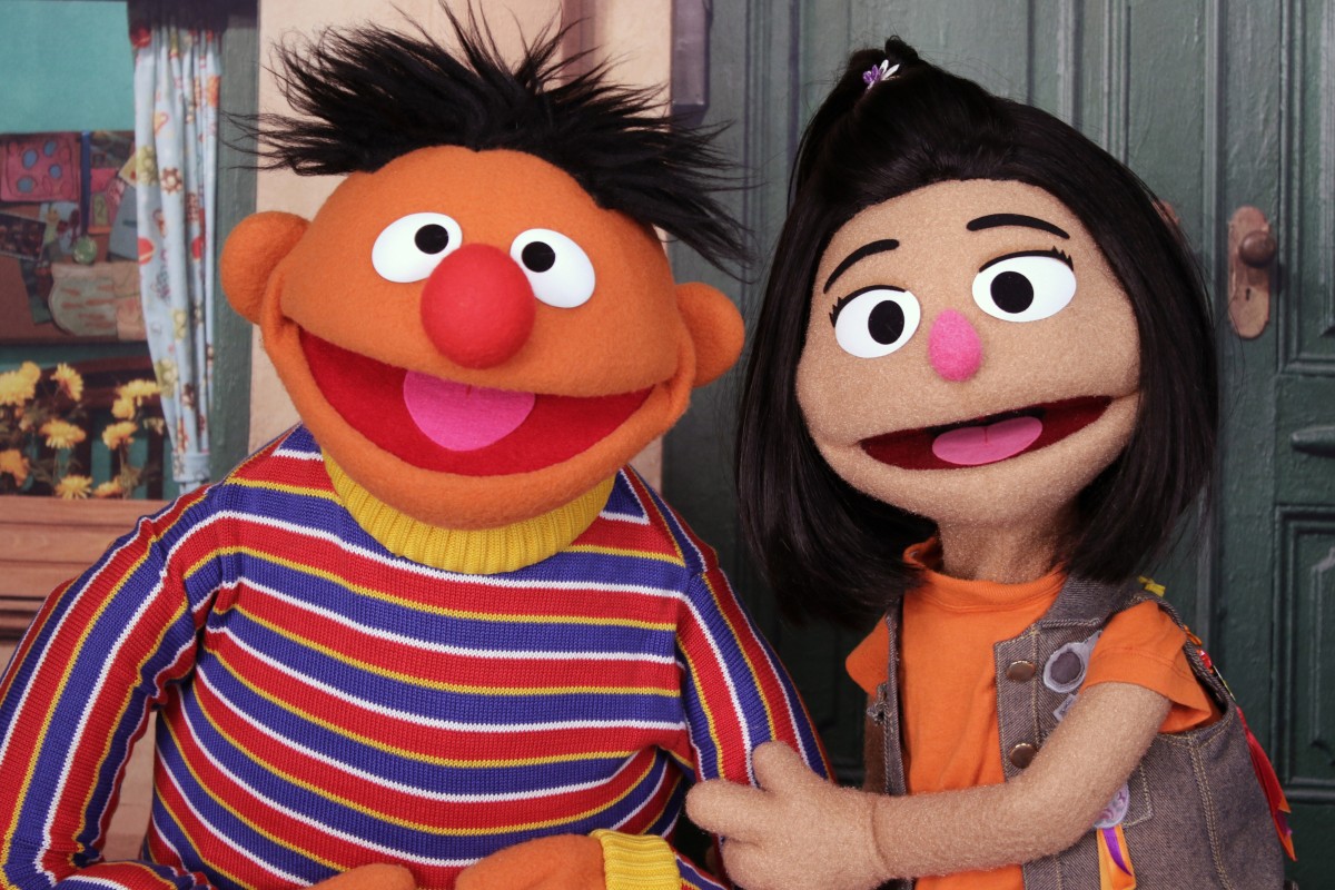 Ernie, a muppet from the popular children’s series “Sesame Street” appears with new character Ji-Young, the first Asian American muppet, on the set of the long-running children’s program. Photo: AP
