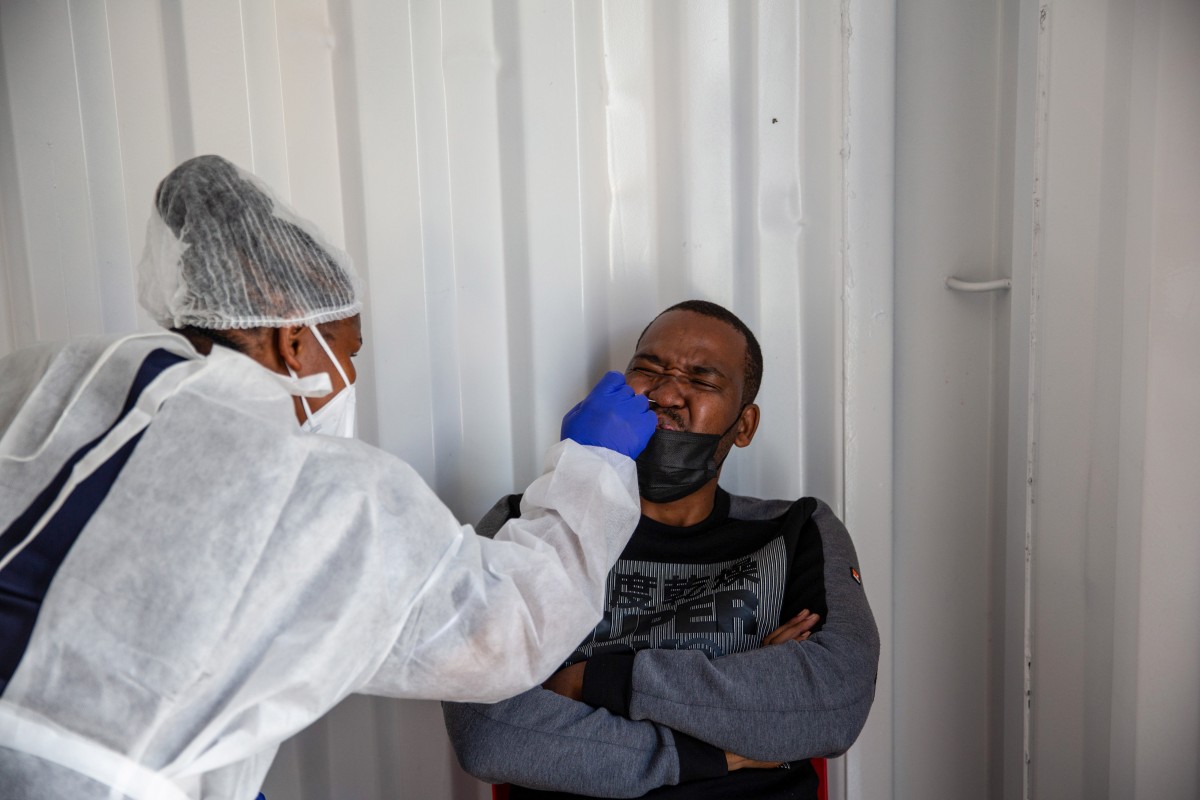 A health worker administers a nasal swab test in the Milnerton district of Cape Town, South Africa. South Africa announced the discovery of a new variant, later christened Omicron, on November 25. Photo: Bloomberg