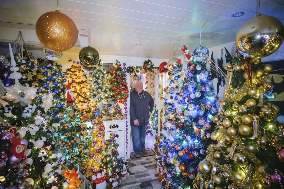 Thomas Jeromin has set a new world record with 444 Christmas trees in his home in Germany. Photo: AP