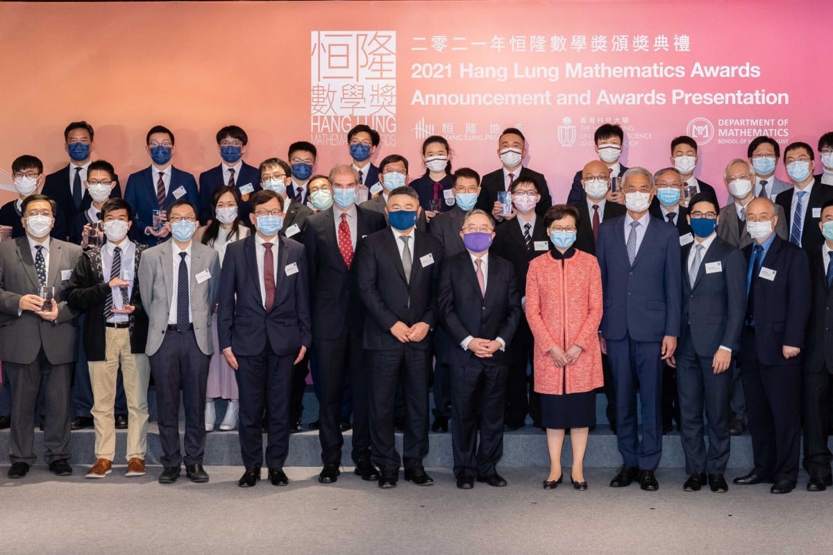 A photo of the winning teams of the 2021 Hang Lung Mathematics Awards with Carrie Lam Cheng Yuet-ngor, the Chief Executive of the Hong Kong Special Administrative Region, Ronnie C. Chan, Chair; Adriel Chan, Vice Chair; and Weber Lo, Chief Executive Officer of Hang Lung Properties; Professor Wei Shyy, President; Professor Yang Wang, Vice President for Institutional Advancement; Professor Andrew Cohen, Lam Woo Foundation Professor, Director of HKUST Jockey Club Institute for Advanced Study and Acting Dean of Science of The Hong Kong University of Science and Technology; and members of the 2021 Hang Lung Mathematics Awards Scientific Committee, Steering Committee, Executive Committee, and Screening Panel. Photo: Hang Lung Properties Limited