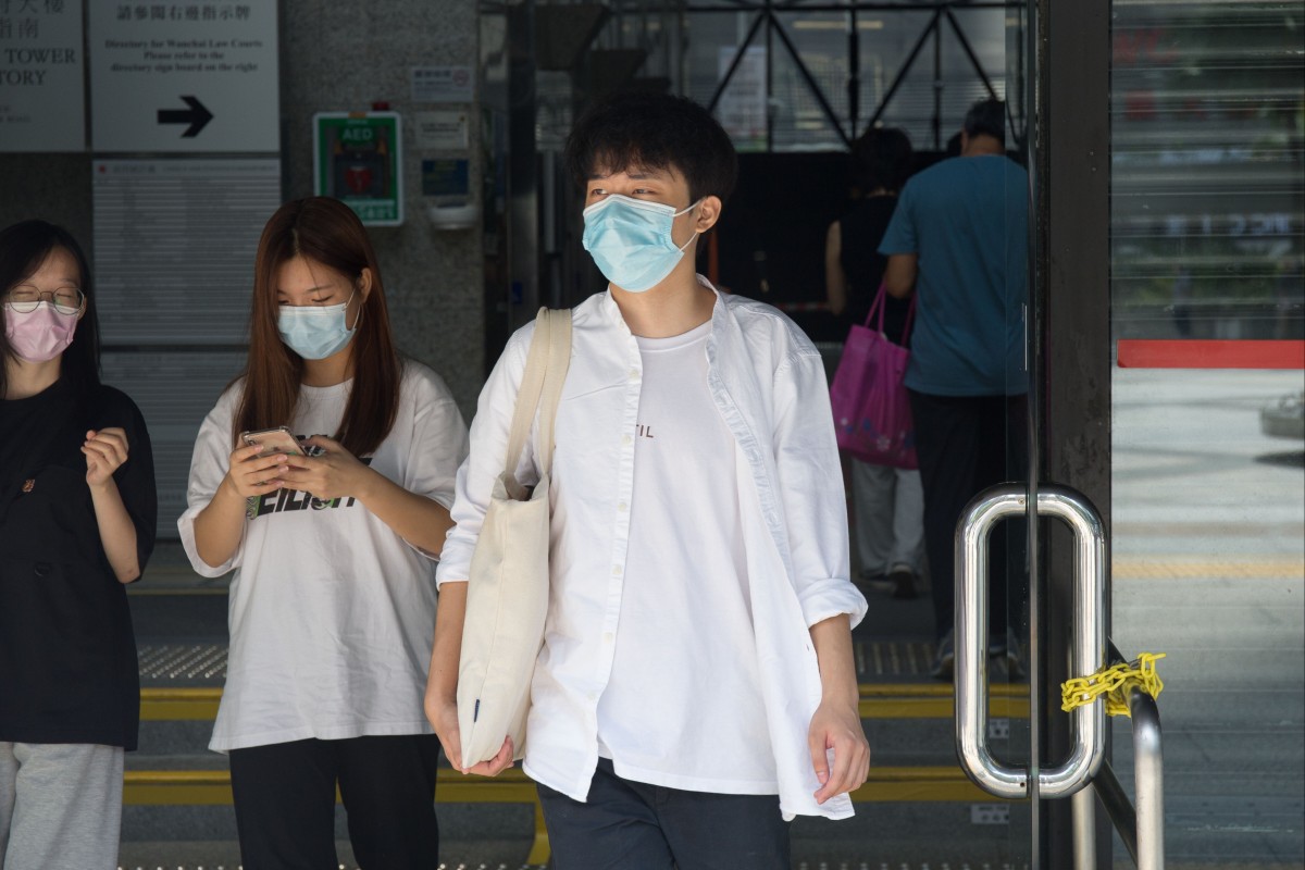 Student Lo Nip-fung, 20, (right) was sentenced to a training centre on Wednesday for a 2020 arson attack on a Hong Kong police station. Photo: SCMP/Brian Wong