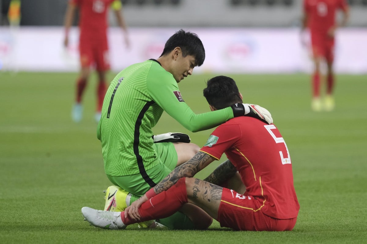 Zhang Linpeng (right) has previously been told to cover his tattoos when representing the China national team. Photo: Xinhua