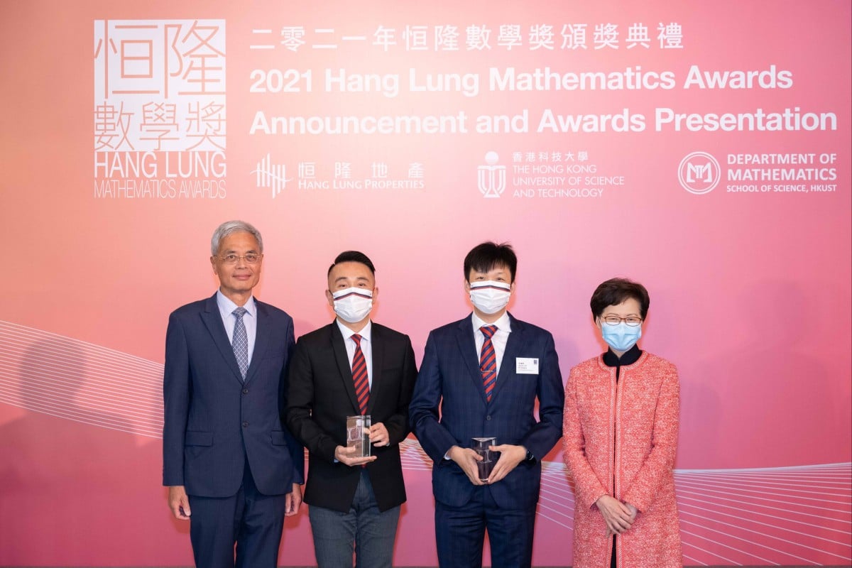 (From right to left) Professor Wei Shyy, president of the Hong Kong University of Science and Technology; Principal Ho Lik-ko of Pui Ching Middle School; teacher Lee Ho-fung of Pui Ching Middle School, and Hong Kong Chief Executive Carrie Lam pose at this year’s Hang Lung Mathematics Awards ceremony. Gold Award winner Chan Tsz-hin is now studying in Britain, but was able to attend virtually. Photo: CWH
