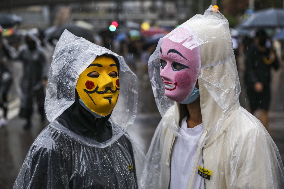 Under the mask law, wearing facial coverings in a public meeting or procession is punishable by up to a year in jail and a HK$25,000 fine. Photo: SCMP / May Tse