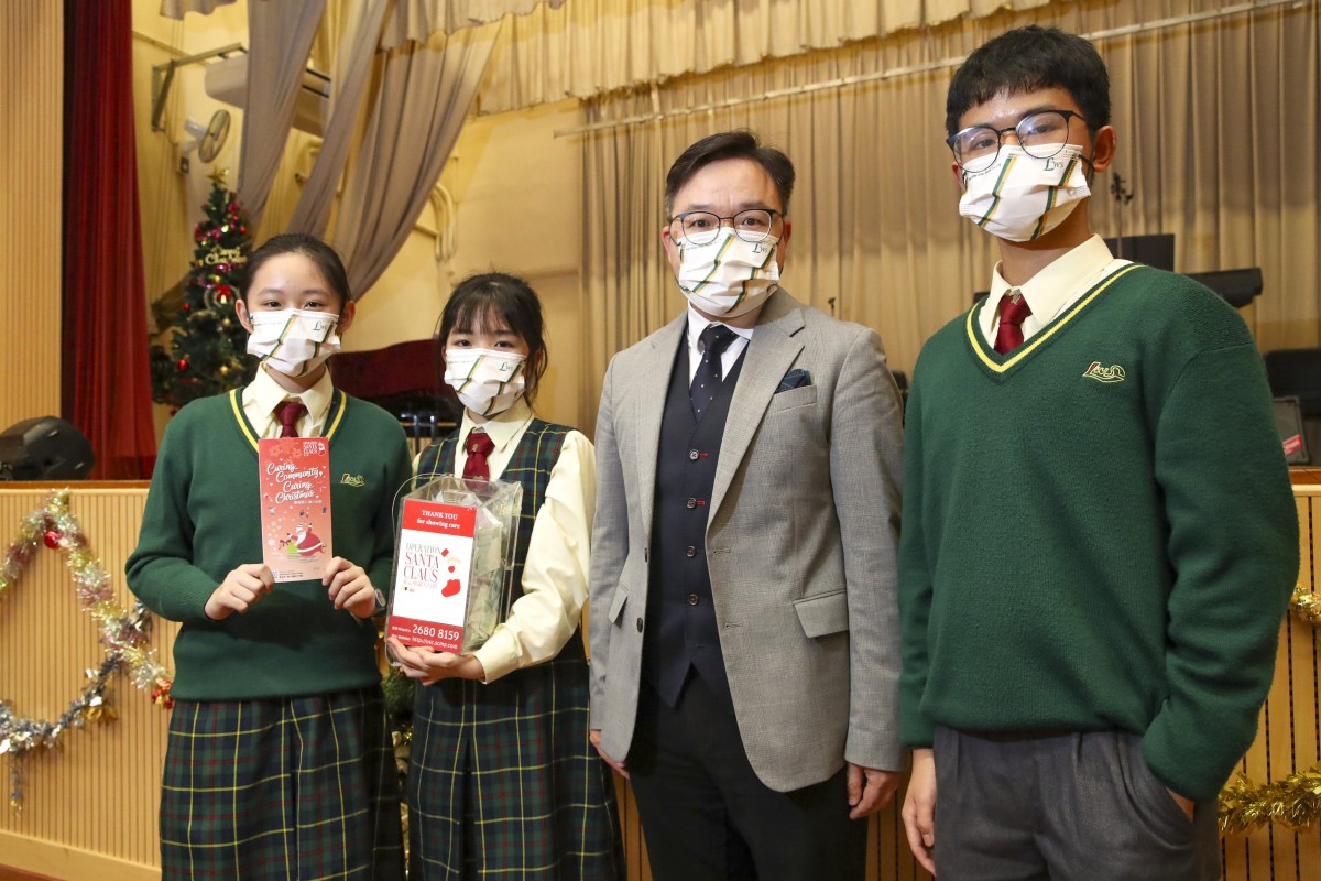 (Left to right) Form Two students Lau Cheuk-ka, Wong Ching-yiu, headmaster Hezekiah Mui Chi-yip, and Cheng Shu-yan from CNEC Lau Wing Sang Secondary School pose after their lunchtime concert to raise money for this year’s OSC initiative. Photo: Edmond So