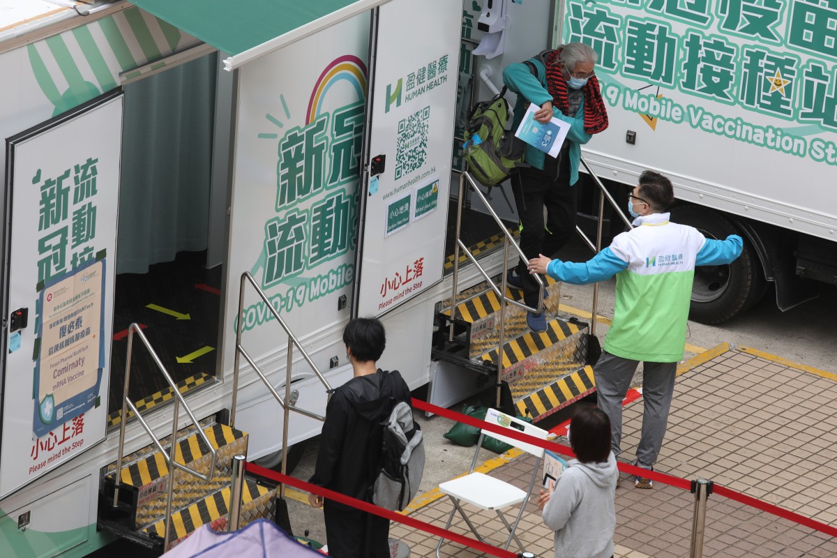 A woman leaves a mobile vaccination station in Hong Kong. Photo: Yik Yeung-man