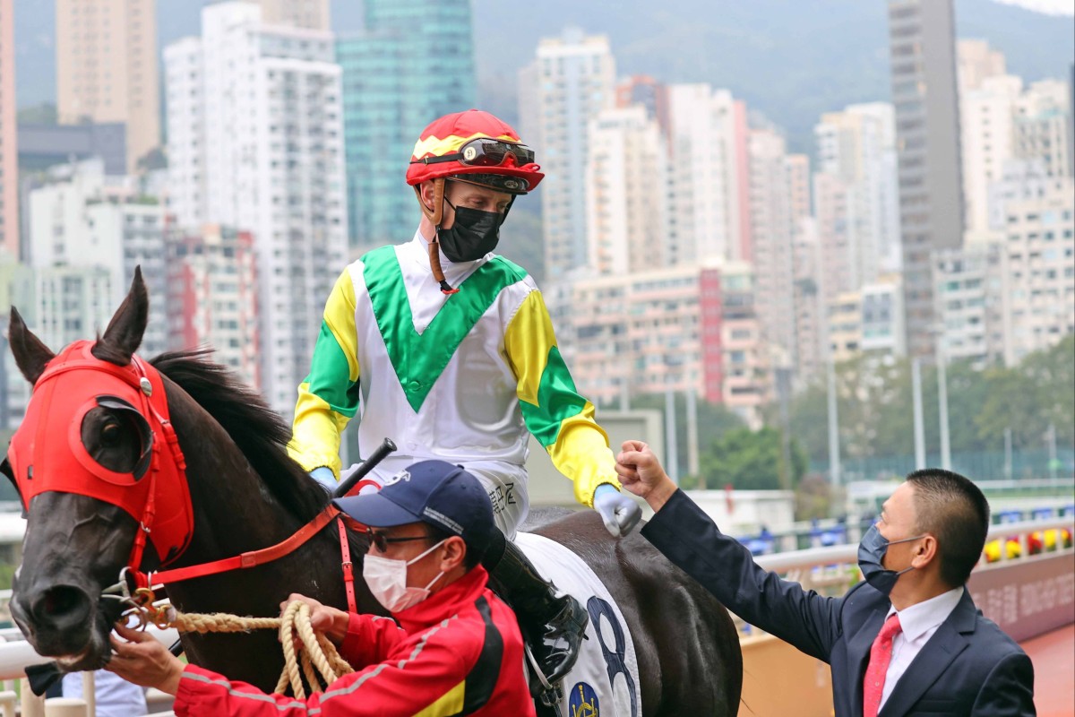 Daniel Moor celebrates his first Hong Kong winner with trainer Danny Shum. Photo: HKJC