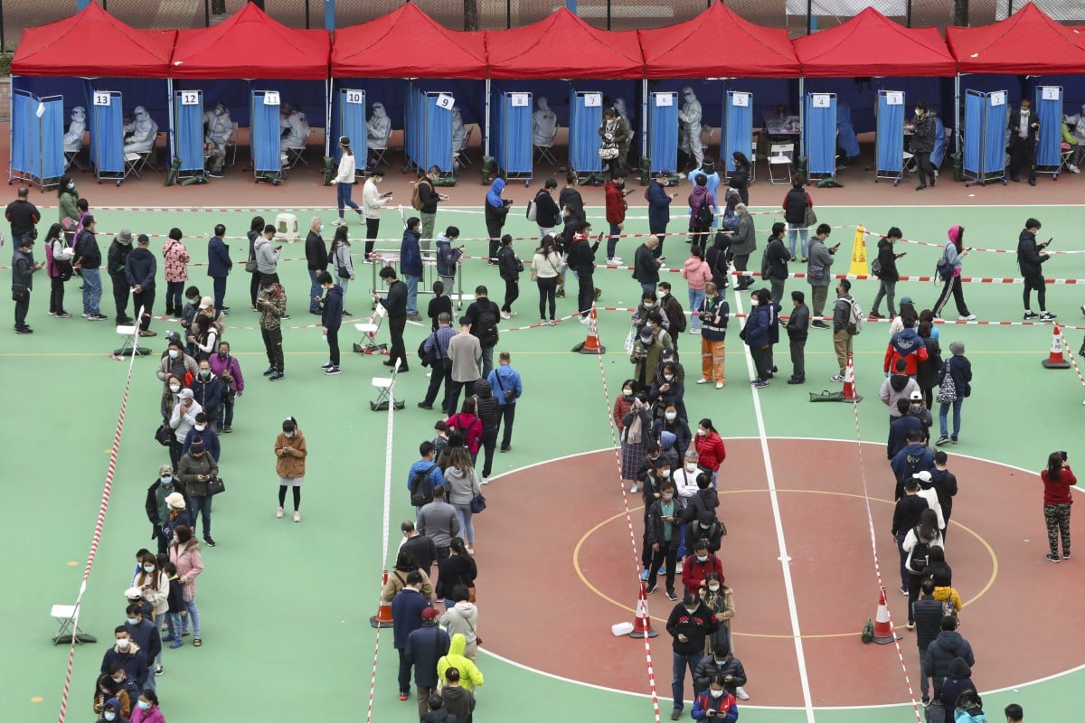 Local residents and workers subject to compulsory testing queue up at a mobile collection station in Yuen Long. Photo: Jelly Tse