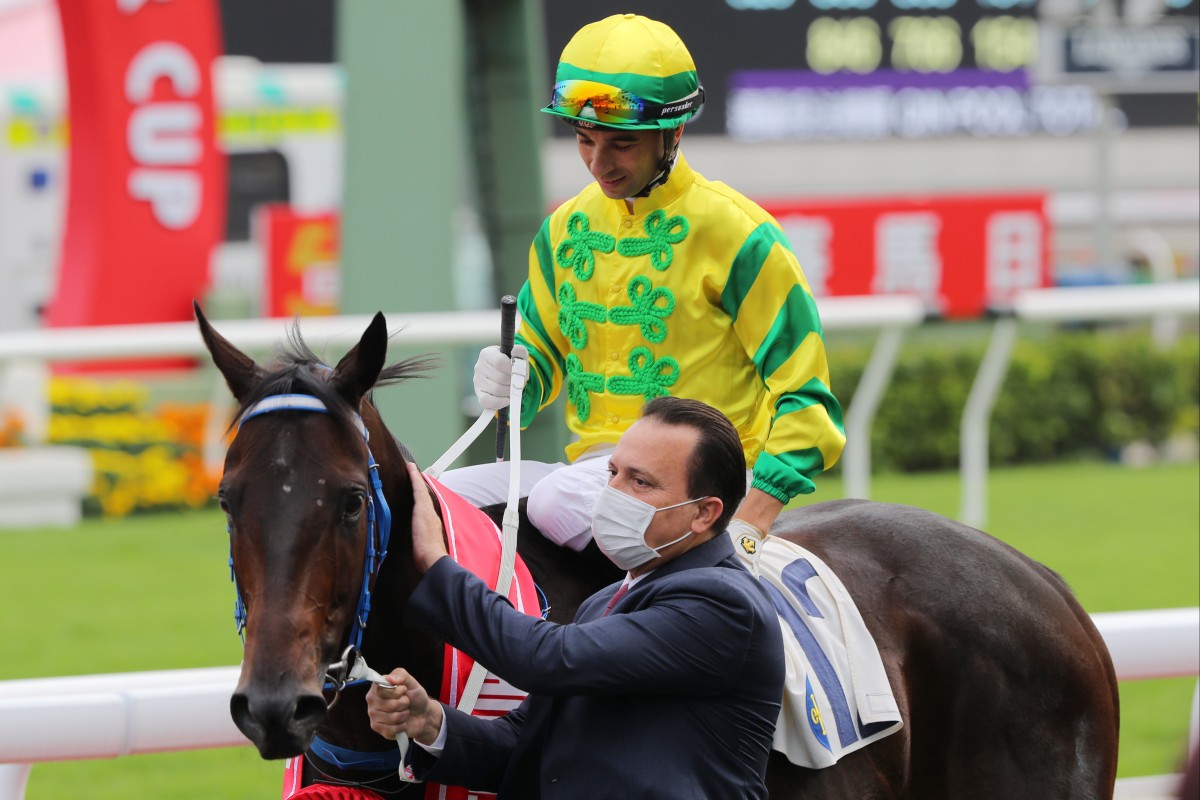 Trainer Caspar Fownes gives Sky Darci a pat after a win under Joao Moreira. Photo: Kenneth Chan