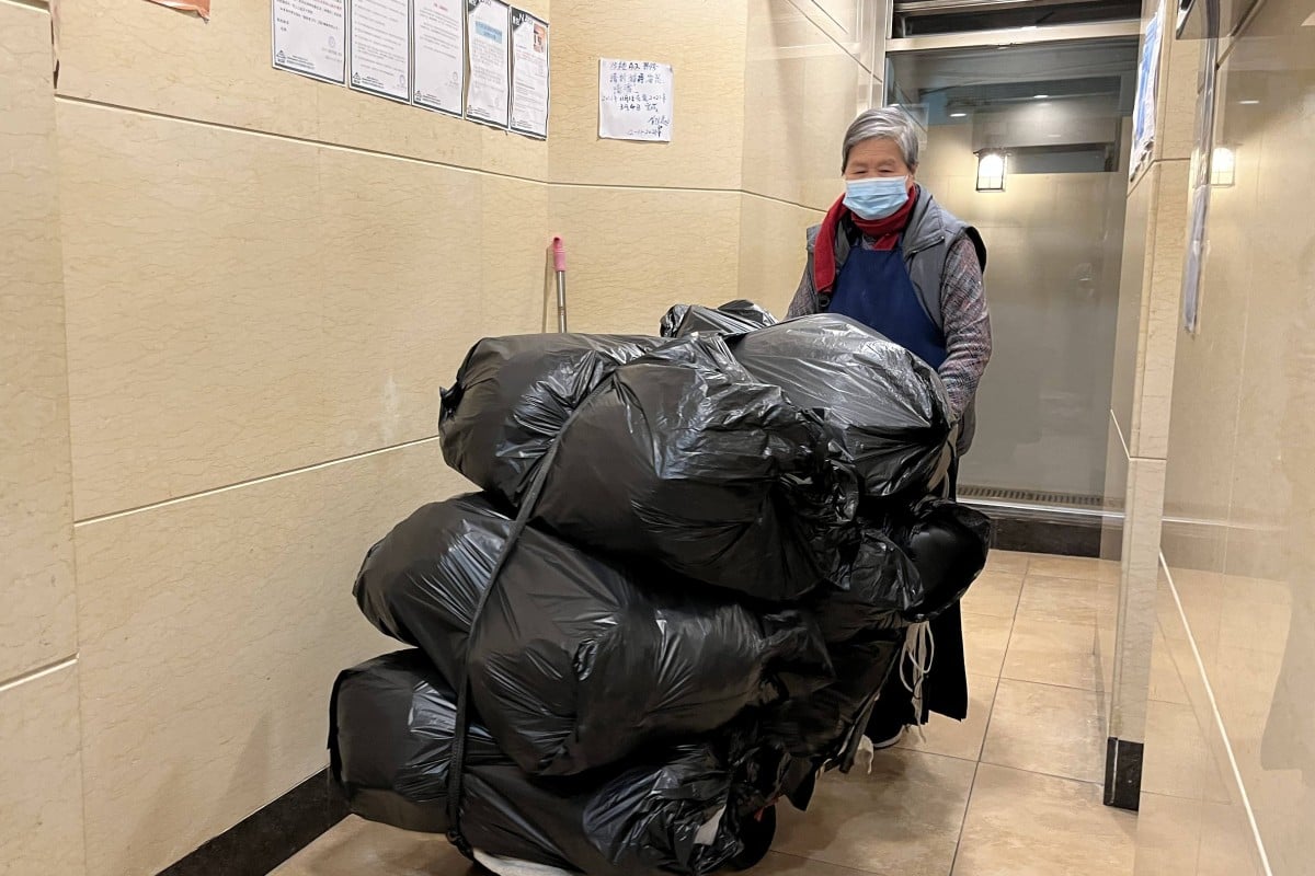 Gwai*, 80, has been cleaning two residential buildings in Sai Wan for the past 32 years. Photo: Kelly Fung
