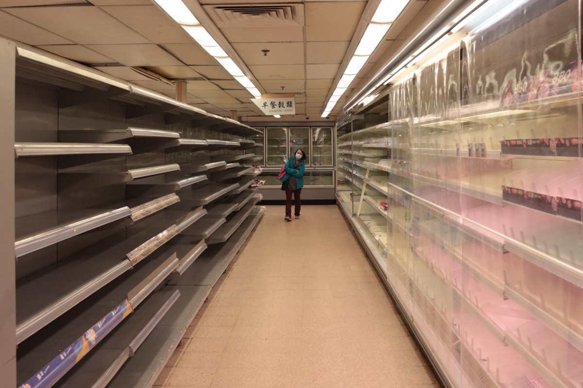 Empty shelves are seen at a supermarket in Sai Wan Ho following rumours of a city-wide lockdown to be imposed amidst the fifth wave of the coronavirus outbreak. Photo: Sam Tsang