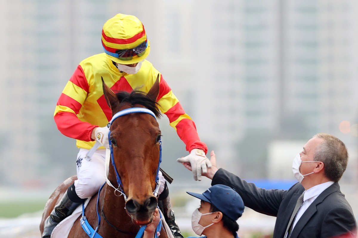 Jockey Joao Moreira and trainer Caspar Fownes enjoy Galaxy Witness’ victory. Photo: HKJC