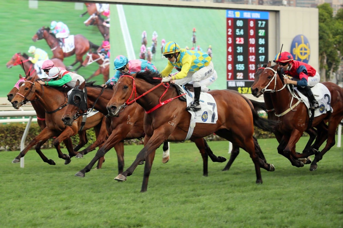 Winning Method (outside) sails past Captain Win (blue and pink silks) at Sha Tin on Saturday. Photo: HKJC