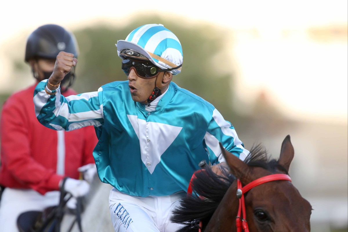 Karis Teetan celebrates winning the Classic Mile aboard Romantic Warrior. Photo: HKJC
