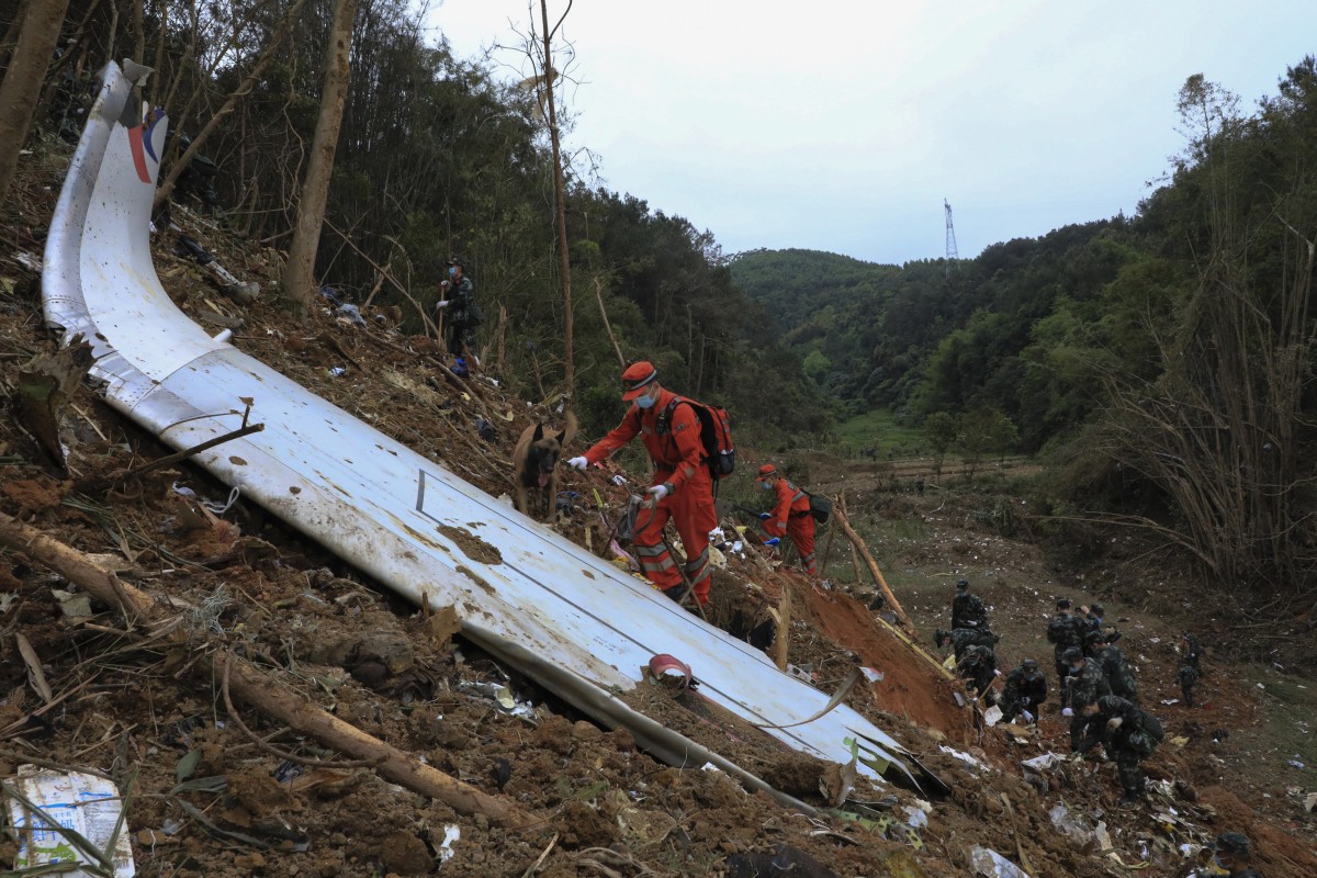 Rescuers search the site in Guangxi Zhuang autonomous region, where a China Eastern Airlines plane crashed on Monday. Photo: Xinhua