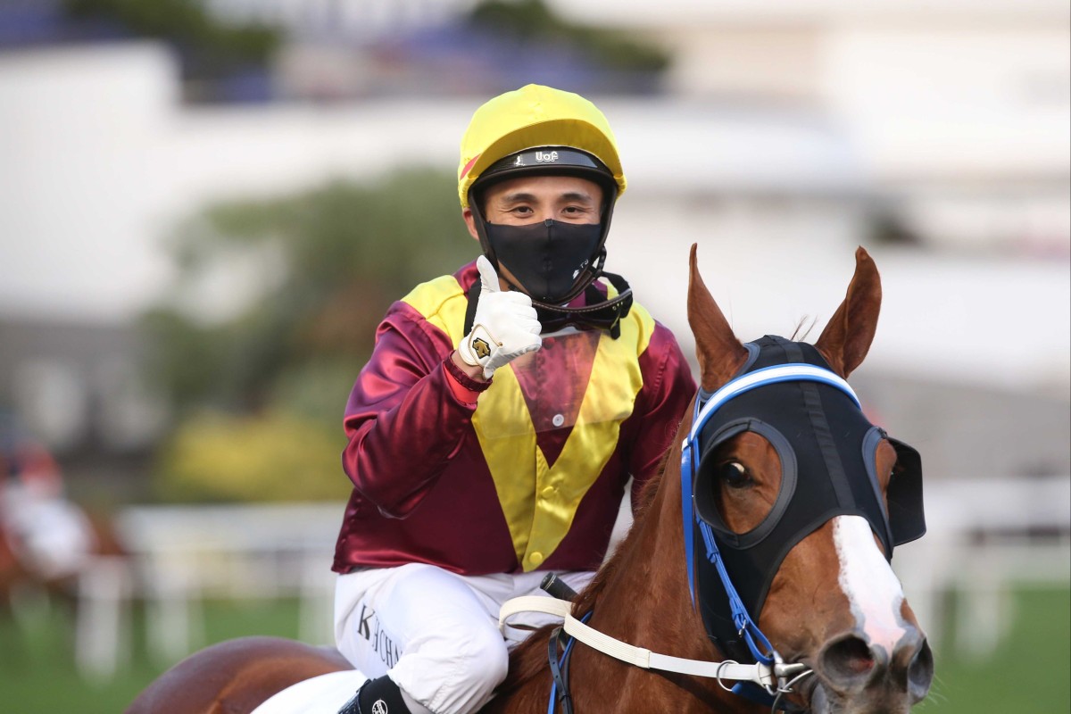 Alfred Chan is all smiles after saluting aboard Kurpany. Photo: HKJC
