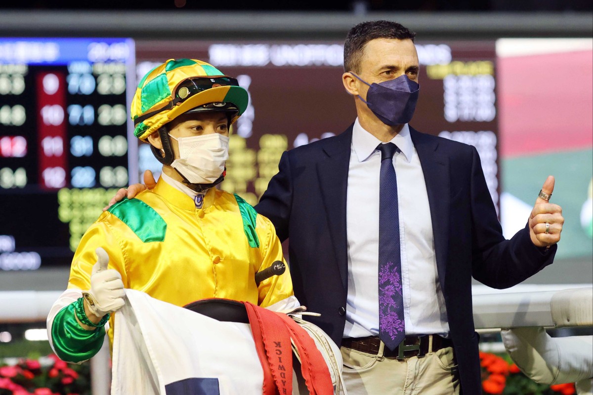 Matthew Chadwick and Douglas Whyte celebrate the victory of Smiling City at Happy Valley. Photo: HKJC