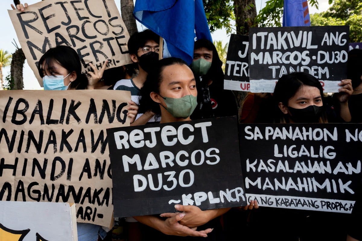 Filipino activists hold placards during a Black Friday Protest in Pasay City. Photo: Reuters