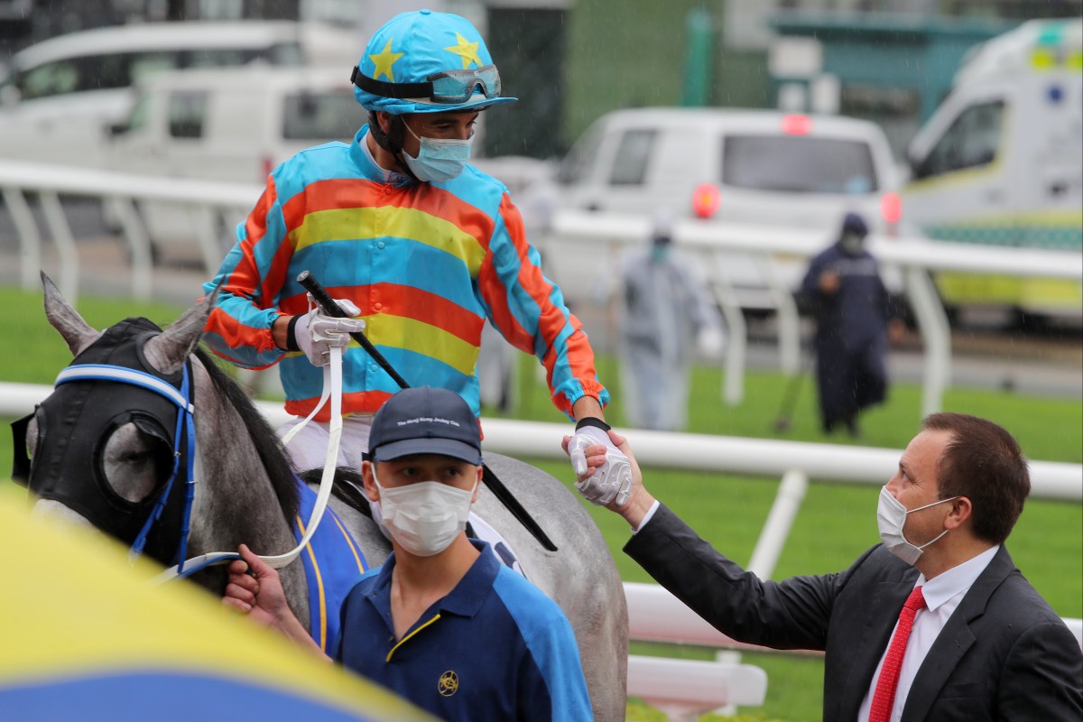 Jockey Joao Moreira and trainer Caspar Fownes celebrate a Senor Toba victory. Photo: Kenneth Chan